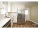 Modern kitchen featuring stainless steel appliances, granite countertops, and updated cabinetry at 611 Greenbriar Ave, Rock Hill, SC 29730