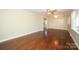 Expansive living room featuring beautiful hardwood floors, a ceiling fan, and a bright, airy atmosphere at 611 Greenbriar Ave, Rock Hill, SC 29730