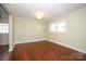 Living room featuring hardwood floors, neutral walls, and window for natural light at 611 Greenbriar Ave, Rock Hill, SC 29730