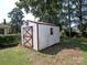 Exterior of a shed with a red-trimmed door, window, and white siding at 611 Greenbriar Ave, Rock Hill, SC 29730