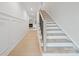 Modern staircase with light wood treads and dark metal railing at 3627 Avalon Ave, Charlotte, NC 28208