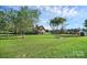 Expansive backyard featuring mature trees, green lawn, and a detached storage shed at 106 Cameron Dr, Kings Mountain, NC 28086