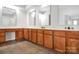 Bathroom featuring double sink vanity, tile flooring, and wood cabinets at 106 Cameron Dr, Kings Mountain, NC 28086