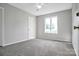 This bedroom has carpet floors, a ceiling fan, and a double window for natural light at 106 Cameron Dr, Kings Mountain, NC 28086