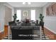 Light and bright dining room with hardwood floors and elegant, modern decor for a welcoming ambiance at 106 Cameron Dr, Kings Mountain, NC 28086