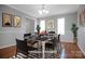 Bright dining room featuring hardwood floors, neutral tones, and modern decor, ready for entertaining at 106 Cameron Dr, Kings Mountain, NC 28086