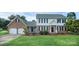 Charming brick and siding home with a well-manicured lawn and two-car garage at 106 Cameron Dr, Kings Mountain, NC 28086