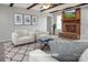 Inviting living room with a brick fireplace, neutral tones, and comfortable seating for relaxing and entertaining at 106 Cameron Dr, Kings Mountain, NC 28086