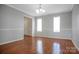 Bright living room boasts hardwood floors, neutral paint, white molding, and lots of natural light at 106 Cameron Dr, Kings Mountain, NC 28086