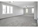 A large living room with carpet, recessed lights, and many double windows at 106 Cameron Dr, Kings Mountain, NC 28086