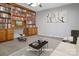 Cozy office space featuring built-in bookshelves, a stylish desk, and comfortable seating, ideal for work at 106 Cameron Dr, Kings Mountain, NC 28086