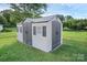 Outdoor storage shed, features double doors, sidelight windows, and a grey shingled roof at 106 Cameron Dr, Kings Mountain, NC 28086