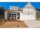 Craftsman style home with stone accents and a two-car garage at 1014 Lowland Way, Waxhaw, NC 28173