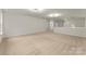 Large bonus room is versatile for use as a play area, office, or media space at 6034 Jepson Ct, Charlotte, NC 28214