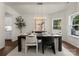 Formal dining room with modern chandelier and views of kitchen at 6034 Jepson Ct, Charlotte, NC 28214