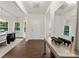Bright foyer featuring hardwood floors, a mirror, and natural light at 6034 Jepson Ct, Charlotte, NC 28214