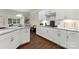 Bright kitchen featuring granite countertops, white cabinets, and modern appliances at 6034 Jepson Ct, Charlotte, NC 28214