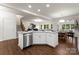 Open kitchen layout with stainless steel appliances, modern cabinetry, and spacious island at 6034 Jepson Ct, Charlotte, NC 28214
