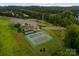 Overhead view of well-maintained tennis courts, part of the community's recreational amenities at 6034 Jepson Ct, Charlotte, NC 28214