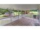 Covered back porch with wooden deck and railing at 4972 Mayble St, Catawba, NC 28609