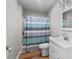 Clean bathroom with white vanity, shower/tub combo, and striped curtain at 4972 Mayble St, Catawba, NC 28609