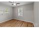 Bright bedroom with two windows and wood-look floors at 4972 Mayble St, Catawba, NC 28609