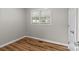 Bright bedroom with two windows, neutral walls, and wood-look floors at 4972 Mayble St, Catawba, NC 28609