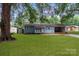 Newly renovated blue house with carport and storage shed at 4972 Mayble St, Catawba, NC 28609