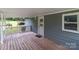 Spacious front porch with wooden deck and railing at 4972 Mayble St, Catawba, NC 28609