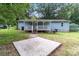 Charming blue house with a covered porch and shed at 4972 Mayble St, Catawba, NC 28609