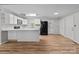 Open kitchen with island and black appliances at 4972 Mayble St, Catawba, NC 28609