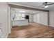 Bright kitchen features white cabinets, wood-look floors, and an island at 4972 Mayble St, Catawba, NC 28609