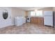 Small, functional basement kitchen with laundry hookups at 1762 Old Carter St, Lancaster, SC 29720