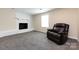 Finished basement room with gray carpet and a recliner at 1762 Old Carter St, Lancaster, SC 29720