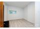 Simple bedroom with wood-look floors and window at 1762 Old Carter St, Lancaster, SC 29720