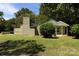 House exterior showcasing a green brick facade and spacious yard at 1762 Old Carter St, Lancaster, SC 29720