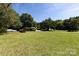 Ranch house with a large backyard and mature trees at 1762 Old Carter St, Lancaster, SC 29720