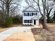 Two-story white house with black shutters and a concrete driveway at 127 Sharon Rd, York, SC 29745