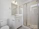 Bright bathroom featuring a glass-enclosed shower and white vanity at 459 Blairhill Rd # 02, Charlotte, NC 28217