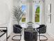 Bright dining room with large windows, a glass table, stylish chairs, and contemporary decor for elegant dining at 459 Blairhill Rd # 02, Charlotte, NC 28217
