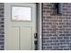 The front door of 459 is painted an on-trend green, with a digital smart lock for modern convenience at 459 Blairhill Rd # 02, Charlotte, NC 28217