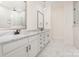 Bathroom featuring dual sinks, white cabinets, marble countertops, and a glass-enclosed shower at 1228 Sage Pine Cir # 12, Clover, SC 29710