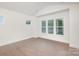 Bright, empty bedroom with vaulted ceiling, hardwood floors, and large windows at 1228 Sage Pine Cir # 12, Clover, SC 29710