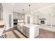 Modern kitchen with white quartz island and gray cabinets at 1228 Sage Pine Cir # 12, Clover, SC 29710