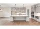 Modern kitchen with white quartz island and gray cabinets at 1228 Sage Pine Cir, Clover, SC 29710