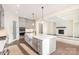 Open-concept kitchen with a large island, stainless steel appliances, and gray cabinets at 1228 Sage Pine Cir # 12, Clover, SC 29710