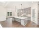 Bright kitchen with white countertops, pendant lighting, and a stainless steel range hood at 1228 Sage Pine Cir # 12, Clover, SC 29710
