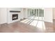 Bright living room featuring a fireplace and sliding glass doors leading to an outdoor space at 1228 Sage Pine Cir # 12, Clover, SC 29710