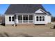 Charming home exterior showcasing a covered porch, white columns, and well-manicured lawn at 1228 Sage Pine Cir # 12, Clover, SC 29710