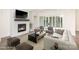 Inviting living room with a cozy fireplace, large windows, and comfortable seating area at 1228 Sage Pine Cir # 12, Clover, SC 29710
